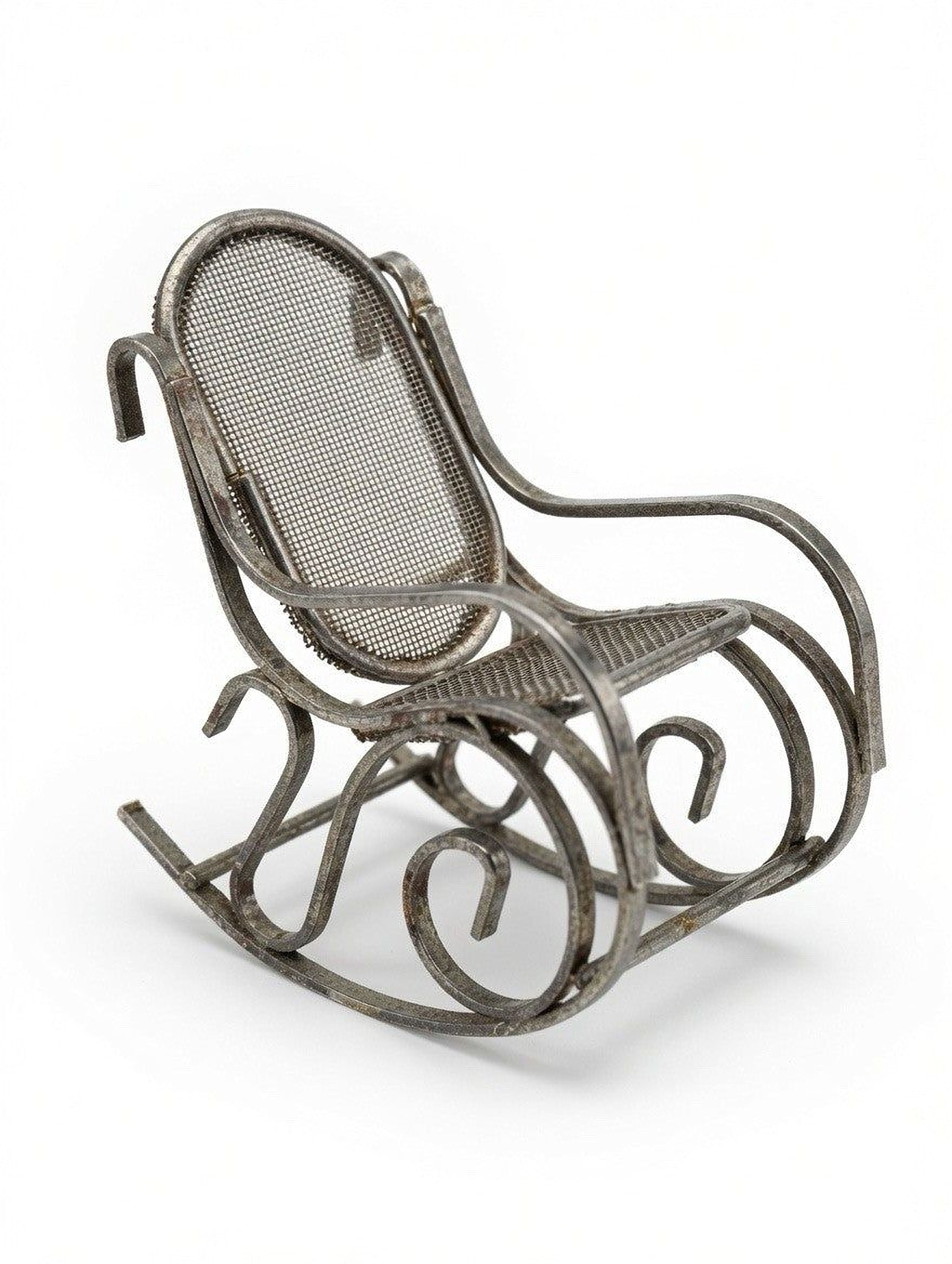 A metal rocking chair with a mesh backrest and curved armrests.